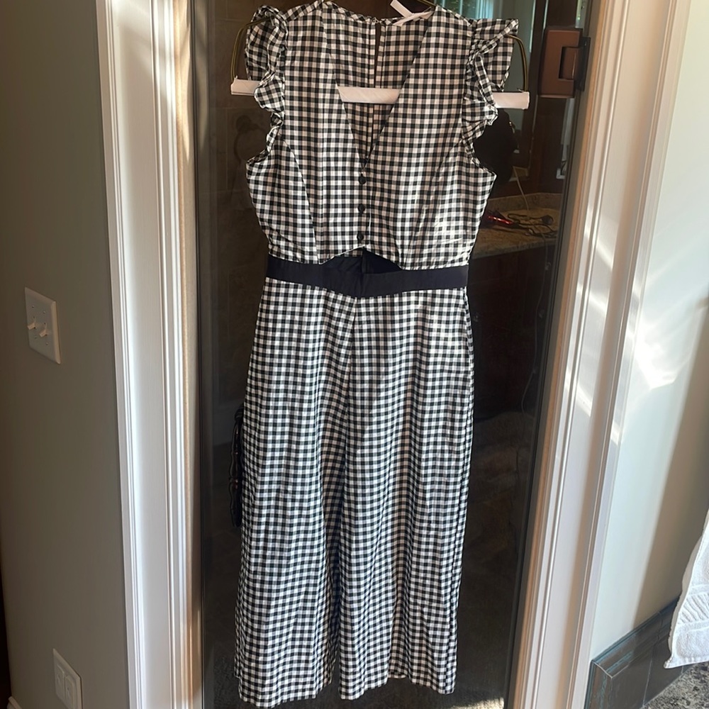 Gingham jumpsuit with cute cutout detail by upper midsection.  Size 6 BCBG
